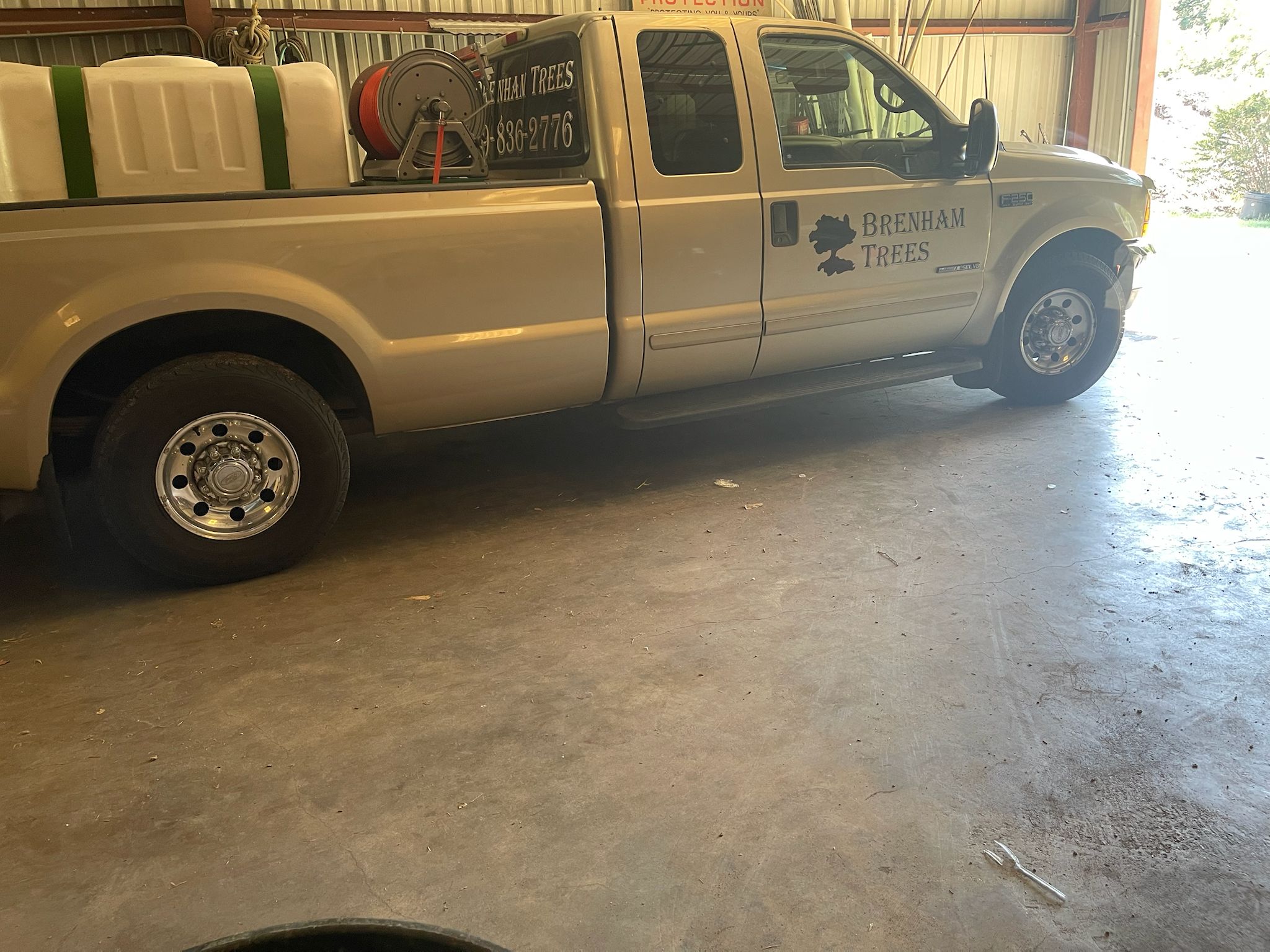 Brenham Trees service truck in the shop bay